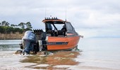 Orange 8.5m Alloy Cabin getting into the water